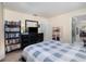 Spacious bedroom featuring a bed, shelves and ensuite bathroom, perfect for relaxation at 690 S Lakemont Ave, Winter Park, FL 32792