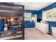 Bright bedroom featuring a bunk bed with desk and a white dresser by the windows at 690 S Lakemont Ave, Winter Park, FL 32792