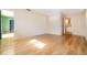 Bedroom featuring hardwood floors, natural lighting, and ensuite bathroom access at 690 S Lakemont Ave, Winter Park, FL 32792