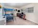 Neutrally decorated bedroom including bunk bed, desk and chair by a large window at 690 S Lakemont Ave, Winter Park, FL 32792
