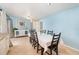 Inviting dining room with a white tablecloth, black chairs, and adjacent access to the kitchen at 690 S Lakemont Ave, Winter Park, FL 32792