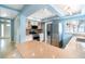 Bright eat-in kitchen showcasing granite countertops, stainless appliances, and ample storage at 690 S Lakemont Ave, Winter Park, FL 32792