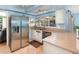 Modern kitchen boasting stainless steel appliances, granite countertops, and built-in features at 690 S Lakemont Ave, Winter Park, FL 32792