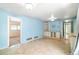 Open living area with tile floors and built in shelving, offering plenty of space for entertaining at 690 S Lakemont Ave, Winter Park, FL 32792