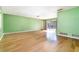 Large living area featuring gleaming hardwood floors, a neutral wall color, and lots of natural light at 690 S Lakemont Ave, Winter Park, FL 32792