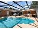 Enjoy this screened-in pool with ample seating and an outdoor grilling area at 690 S Lakemont Ave, Winter Park, FL 32792