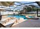 Relax in this enclosed pool area, featuring sun loungers, a basketball hoop, and a tranquil spa at 690 S Lakemont Ave, Winter Park, FL 32792