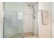 Shower featuring glass doors, built-in bench and neutral tiling that creates a spa-like feel at 690 S Lakemont Ave, Winter Park, FL 32792