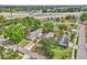 Aerial view of a home with mature trees providing shade and located near a major highway and local amenities at 712 Baffie Ave, Winter Park, FL 32789