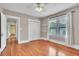 Bedroom featuring hardwood floors, a ceiling fan, a window, and a double door closet at 712 Baffie Ave, Winter Park, FL 32789