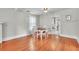 Bright dining area with hardwood floors, a classic ceiling fan, and access to the kitchen at 712 Baffie Ave, Winter Park, FL 32789
