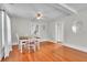 Cozy dining area featuring hardwood floors, ample natural light, and a charming ceiling fan at 712 Baffie Ave, Winter Park, FL 32789