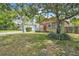 Well-kept home with mature trees, a manicured lawn, and great curb appeal at 712 Baffie Ave, Winter Park, FL 32789