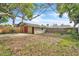 Garage with adjacent parking pad in the backyard at 712 Baffie Ave, Winter Park, FL 32789
