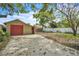 Detached garage with driveway in backyard at 712 Baffie Ave, Winter Park, FL 32789