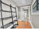 Hallway features hardwood floors and view of kitchen at 712 Baffie Ave, Winter Park, FL 32789