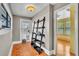 Hallway with hardwood floors leads to bedroom and backyard entry at 712 Baffie Ave, Winter Park, FL 32789