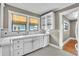 Charming kitchen with vintage tile flooring and countertops and modern stainless steel appliances at 712 Baffie Ave, Winter Park, FL 32789
