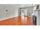 Spacious living room with hardwood floors, fireplace, and access to a bright sunroom at 712 Baffie Ave, Winter Park, FL 32789