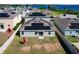 Aerial view of the backyard with solar panels on the roof at 744 Simone Ct, Haines City, FL 33844