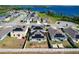 Aerial view showcasing houses with solar panels in a lakeside community at 744 Simone Ct, Haines City, FL 33844