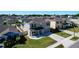 A peaceful neighborhood featuring cozy homes with well-maintained lawns and tree-lined streets under a clear blue sky at 744 Simone Ct, Haines City, FL 33844