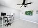 Bright bedroom with a modern desk setup and stylish decorations at 744 Simone Ct, Haines City, FL 33844