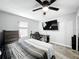 This bedroom features a ceiling fan, carpet, and a TV-ready wall at 744 Simone Ct, Haines City, FL 33844