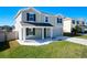 Beautifully landscaped front yard of this two-story home with an attached garage and inviting covered porch at 744 Simone Ct, Haines City, FL 33844