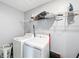 Laundry room featuring a white washer and dryer at 744 Simone Ct, Haines City, FL 33844
