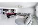 Open living area with a kitchen, pool table, and sectional sofa at 744 Simone Ct, Haines City, FL 33844