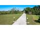 Scenic walkway through lush green spaces, perfect for outdoor exercise and enjoying nature at 744 Simone Ct, Haines City, FL 33844