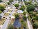 A neighborhood with tree-lined streets, showcasing a cozy home with an easy access to nearby amenities at 7714 Lady Frances Way, Orlando, FL 32807
