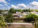 Scenic view of single-Gathering home with enclosed porch and a fenced backyard at 7714 Lady Frances Way, Orlando, FL 32807