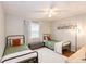 Shared bedroom with two twin beds, soft rug, and art hanging on the wall at 7714 Lady Frances Way, Orlando, FL 32807