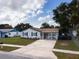 Charming single-story home with neutral siding, classic shutters, and a welcoming covered front porch at 7714 Lady Frances Way, Orlando, FL 32807