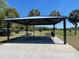 Outdoor pavilion with picnic tables and benches, ideal for gatherings, surrounded by open space at 7714 Lady Frances Way, Orlando, FL 32807