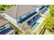 Aerial view of the backyard and the house with a private pool and an outdoor kitchen at 8384 Ludington Cir, Orlando, FL 32836