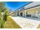Expansive backyard view with a pool, patio, and lush green space, creating an inviting outdoor oasis at 8384 Ludington Cir, Orlando, FL 32836