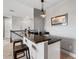 Stylish bar area with granite countertop, seating, and modern lighting, ideal for entertaining guests at 8384 Ludington Cir, Orlando, FL 32836