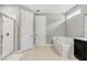 This bathroom features a glass shower and a separate tub with nice tile floors and vanity at 8384 Ludington Cir, Orlando, FL 32836