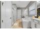 Bathroom features a soaking tub, walk-in shower and double sinks at 8384 Ludington Cir, Orlando, FL 32836