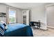 Well-lit bedroom with large window, desk, and walk-in closet, offering comfort and convenience at 8384 Ludington Cir, Orlando, FL 32836