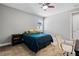 Cozy bedroom featuring a comfy bed, bedside tables, and a window for natural light and fresh air at 8384 Ludington Cir, Orlando, FL 32836