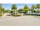 Elegant gated community entrance, Estates at Parkside, with lush landscaping and stately signage, offers secure and luxurious living at 8384 Ludington Cir, Orlando, FL 32836