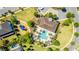 Aerial view of community pool with play area, hot tub, and picnic tables at 8384 Ludington Cir, Orlando, FL 32836