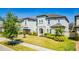 Attractive home with a landscaped lawn, stone accents, and a paver driveway, creating curb appeal at 8384 Ludington Cir, Orlando, FL 32836