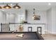Bright game room boasts a pool table, bar and stools plus stairs to the second floor at 8384 Ludington Cir, Orlando, FL 32836