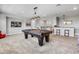 Entertainment room featuring a pool table, bar area, and an open layout great for entertaining at 8384 Ludington Cir, Orlando, FL 32836