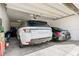 Attached two car garage featuring an automatic garage door opener and room for storage at 8384 Ludington Cir, Orlando, FL 32836